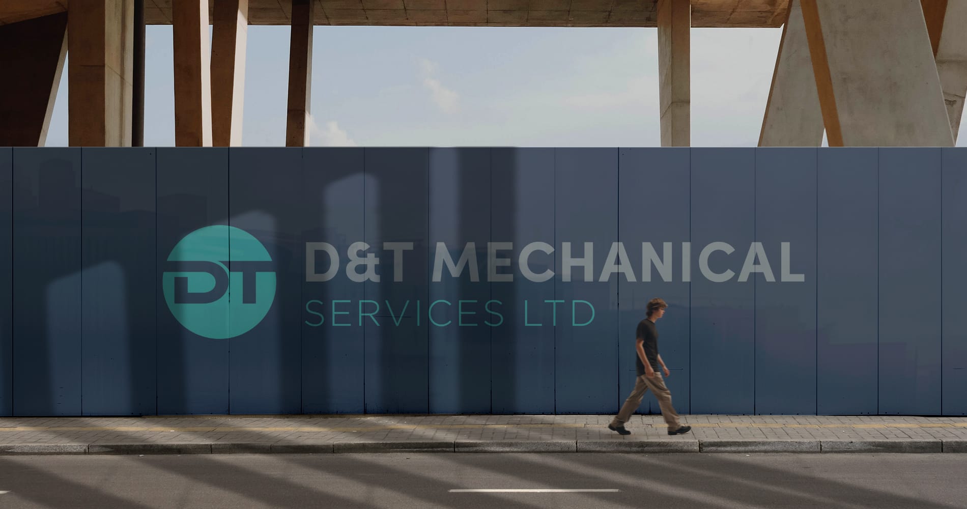 A large billboard advertising D&T Mechanical Services Logo design.